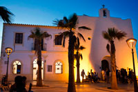 Formentera. Tourists, Church in main square of Sant Francesc Xavier, San Francisco Javier, Formentera, Pityuses, Balearic Islands, Spain, Europe.  