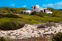 Formentera. Typical white house of Formentera. Migjorn beach, Formentera island, Balears Islands, Spain. 