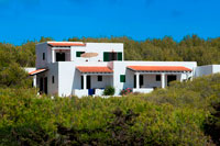 Formentera. Typical white house of Formentera. Migjorn beach, Formentera island, Balears Islands, Spain. 