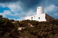 Formentera. Es Molí de Sal Restaurant, Formentera. Ancient white salt windmill Formentera. Balearic islands architecture white mill in Formentera over blue sky, Balearic island, Spain.