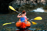 Formentera. Mother and daughter doing kayaking on Cala Sahona, Formentera, Balearics Islands, Spain. Barbaria Cape.