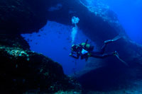 Formentera. Diving in Arch area, Formentera, Balearic Islands, Mediterranean Sea, Spain. The Arch offers a rich, recreational seascape. It is an ideal dive site to brush up on your diving techniques or to simply enjoy a pleasant dive. Diving at the Arch is perfect for practicing your diving technique because diving can take place at all levels: from 3 to 15 metres, with a progressive depth gradient. The Arch is also one of the best dive sites in Formentera for initiation dives, as it offers a fascinating dive at shallow depths.