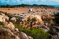 Formentera. Sunrise. Hippy tourist resting in a van VW near of the Lighthouse, Faro de la Mola, Formentera, Pityuses, Balearic Islands, Spain, Europe