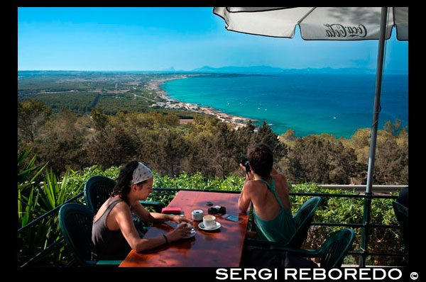 Couple at Es Mirador bar and restaurant Ibiza and Es Vedra rock at the sunset FORMENTERA Balearic Islands SPAIN  It’s getting close to sunset, and a bit chilly, but I have no desire to leave. A structured landscape of medieval cisterns and fruit trees, Es Broll de Buscastell, the site of an ancient freshwater spring, reminds me of nothing so much as the Garden of Eden. It’s absolutely still, fragrant with pine, and the cool water is perfect for a lazy dip. Though I’ve been coming to Ibiza for nearly a decade, this is my first time at Es Broll, a brilliant suggestion from English friends who have summered on this Mediterranean island long enough to know its secrets. We pick a few plums and figs before decamping.