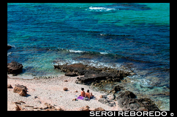 Nude couple in Es caló des Mort, Migjorn beach, Formentera, Balears Islands, Spain. Holiday makers, tourists, Es caló des Mort, beach, Formentera, Pityuses, Balearic Islands, Spain, Europe. Spain; Formentera; Migjorn; beach; nude; naked; natural; eco; nudist; island; balearic; mitjorn; es calo; calo; des mort; des; morts; swim; couple; swimming; Baleares; atrraction; destination; Europe; sand; European; holiday; travel; islands; blue; turquoise; mitjorn; mediterranean; photos; place; spanish; sun; beaches; break; calm; clear; coast; color; colour; dawn; day; daybreak; destination; dune; early; flat; formentera; holiday; horizon; horizontal; island; islas; landscape; mediterranean; migjorn; mist; bodies; body; busy; coast; coastline; coastlines; coasts; crowded; day; daylight; daytime; de; during; europe; european; outside; morning; pitiuses; sandy; scene; sea; south; spain; summer; vacation; view; wave; waves; tourism; touristic; vacation; view; Balearics; beautiful; beauty; paradise; fun; happy; coastal; paradisiac; popular