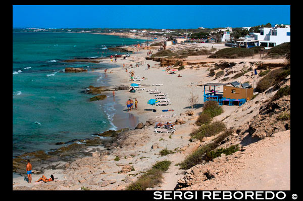 Migjorn beach, Formentera, Balears Islands, Spain. Hotel Riu la Mola. Holiday makers, tourists, Platja de Migjorn, beach, Formentera, Pityuses, Balearic Islands, Spain, Europe. Spain; Formentera; Migjorn; beach; island; balearic; mitjorn; Baleares; atrraction; destination; Europe; sand; European; holiday; travel; islands; mediterranean; photos; place; spanish; sun; beaches; break; calm; clear; coast; color; colour; dawn; day; daybreak; destination; dune; early; flat; formentera; holiday; horizon; horizontal; island; islas; mitjorn; landscape; mediterranean; migjorn; mist; bodies; body; busy; coast; coastline; coastlines; coasts; crowded; day; daylight; daytime; de; during; europe; european; outside; morning; pitiuses; sandy; scene; sea; south; spain; summer; vacation; view; wave; waves; tourism; touristic; vacation; view; Balearics; beautiful; beauty; paradise; fun; happy; coastal; paradisiac; popular