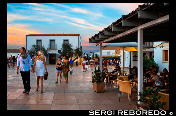 Tourists, Bars and restaurants in main square of Sant Francesc Xavier, San Francisco Javier, Formentera, Pityuses, Balearic Islands, Spain, Europe.   Spain; Formentera; island; balearic; Sant Francesc; Xavier; San Francisco; Francisco; Javier; main; sunset; square; central; typical; white; houses; house; bar; bars; rentaurant; restaurants; tourists; nice; town hall; day; daylight; daytime; during; europe; european; exterior; exteriors; formentera; holiday; holidays; island; islands; javier; journey; outdoor; photo; photos; pityuses; place; places; san; sant; shot; shots; small; south; southern; spain; spanish; square; squares; tourism; tourists; town; towns; travel; travelling; travels; trip; trips; vacation; vacations; village; villages; Baleares; atrraction; destination; Europe; European; holiday; travel; islands; mediterranean; photos; place; spanish; sun; tourism; touristic; vacation; view; Balearics; beautiful; beauty; paradise; fun; happy; coastal; paradisiac; popular