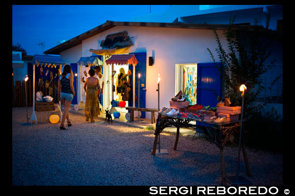 Fashion shop in Isidor Macabich street of Sant Francesc Xavier, San Francisco Javier, Formentera, Pityuses, Balearic Islands, Spain, Europe.  Next to the Constitution square. Spain; Formentera; island; balearic; Sant Francesc; Xavier; San Francisco; Francisco; Javier; main; square; central; typical; white; houses; house; shops; shop; vintage; dress; dresses; fashion; store; tourists; nice; town hall; day; daylight; daytime; during; europe; european; exterior; exteriors; formentera; holiday; holidays; island; islands; javier; journey; outdoor; photo; photos; pityuses; place; places; san; sant; shot; shots; small; south; southern; spain; spanish; square; squares; tourism; tourists; town; towns; travel; travelling; travels; trip; trips; vacation; vacations; village; villages; Baleares; atrraction; destination; Europe; European; holiday; travel; islands; mediterranean; photos; place; spanish; sun; tourism; touristic; vacation; view; Balearics; beautiful; beauty; paradise; fun; happy; coastal; paradisiac; popular