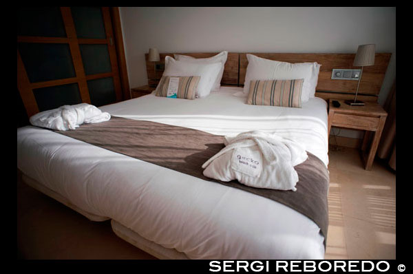 Gecko luxury boutique Hotel, Migjorn beach, Formentera Island, Balearic Islands, Spain, Europe. Bed inside a luxury room.  Spain; Formentera; island; Gecko; Hotel; boutique; luxury; five; stars; four; balearic; Baleares; bed; inside; room; atrraction; destination; Europe; European; beach; ca mari; mari; club; holiday; travel; islands; balearic islands; beach; formentera; horizontal; hotel gecko; mediterranean; migjorn; migjorn beach; people; playa de migjorn; sea; seaside; spain; water; mediterranean; photos; place; spanish; sun; tourism; touristic; vacation; view; Balearics; beautiful; beauty; paradise; fun; happy; coastal; paradisiac; popular; destination; eivissa; european; geographie; geography; germany; holiday; hotel gecko; beach club; ibiza; insel; island; islands; islas; mediterenean; mediterranean; migjom; migjorn; photography; photos; platja; playa; playa migjom; sea; south; southern; spain; spanien; spanish; tourism; tourismus; tourist; travel