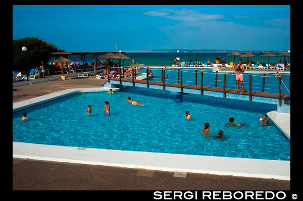 Swimming pool of Insotel Club Maryland, Migjorn beach, Formentera, Balears Islands, Spain. Holiday makers, tourists, Platja de Migjorn, simming pool, Formentera, Pityuses, Balearic Islands, Spain, Europe. Spain; Formentera; Insotel; club; maryland; Insotel Club; Migjorn; swimming pool; swimming; pool; swim; island; balearic; mitjorn; Baleares; atrraction; destination; Europe; sand; European; holiday; travel; islands; mediterranean; photos; place; spanish; sun; beaches; break; calm; clear; coast; color; colour; dawn; day; daybreak; destination; dune; early; flat; formentera; holiday; mitjorn; horizon; horizontal; island; islas; landscape; mediterranean; migjorn; mist; bodies; body; busy; coast; coastline; coastlines; coasts; crowded; day; daylight; daytime; de; during; europe; european; outside; morning; pitiuses; sandy; scene; sea; south; spain; summer; vacation; view; wave; waves; tourism; touristic; vacation; view; Balearics; beautiful; beauty; paradise; fun; happy; coastal; paradisiac; popular