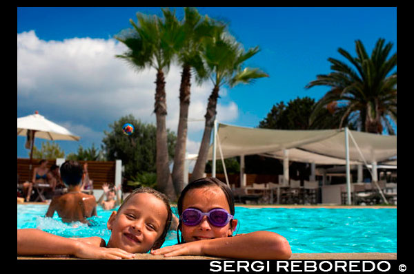 Gecko luxury boutique Hotel, Migjorn beach, Formentera Island, Balearic Islands, Spain, Europe. Girls in the swimming pool. Spain; Formentera; island; Gecko; Hotel; boutique; luxury; five; stars; four; balearic; Baleares; girl; swimming pool; pool; swimming; swim; girls; nice; beautiful; coast; atrraction; destination; Europe; European; beach; club; holiday; travel; islands; balearic islands; beach; formentera; horizontal; hotel gecko; mediterranean; migjorn; migjorn beach; people; playa de migjorn; sea; seaside; spain; water; mediterranean; photos; place; spanish; sun; tourism; touristic; vacation; view; Balearics; beautiful; beauty; paradise; fun; happy; coastal; paradisiac; popular; destination; eivissa; european; geographie; geography; germany; holiday; hotel gecko; beach club; ibiza; insel; island; islands; islas; mari; mediterenean; mediterranean; migjom; migjorn; photography; photos; platja; playa; playa migjom; sea; south; southern; spain; spanien; spanish; tourism; tourismus; tourist; travel