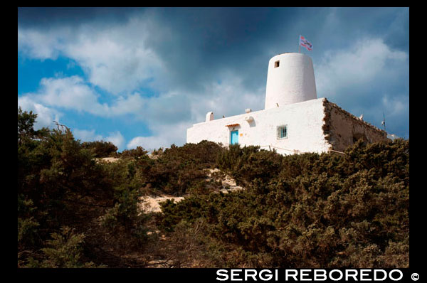 Es Molí de Sal Restaurant, Formentera. Ancient white salt windmill Formentera. Balearic islands architecture white mill in Formentera over blue sky, Balearic island, Spain. Spain; Formentera; island; mill; white; moli de sal; restaurant; house; houses; architecture; baleares; balearic; bath; beach; beautiful; blue; landmark; old; salt; building; buildings; church; city; coast; color; construction; country; destination; door; eivissa; energy; europe; formentera; fun; gay; green; harbor; hill; holiday; holidays; house; ibiza; island; landmark; landscape; life; mediterranean; mill; mills; nature; ocean; old; peaceful; postcard; power; relax; rock; rural; rustic; scenic; sea; sky; spain; spanish; stone; stones; summer; sun; tourism; tower; travel; typical; vacation; view; village; water; white; wind; windmill; balearic; Baleares; atrraction; destination; Europe; European; holiday; travel; islands; mediterranean; photos; place; spanish; sun; tourism; touristic; vacation; view; Balearics; beautiful; beauty; paradise; fun; happy; coastal; paradisiac; popular