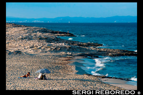 Sa Roqueta Beach and Ses Illetes Beach, Balearic Islands, Formentera, Spain. Nice girl lying in the sand. Spain; Formentera; island; Ses Illetes; beach; sa roqueta; illetes; roqueta; coastline; marine; scene; outdors; sand; summer; balearic; nice; sea; boats; pretty; girl; woman; lying; umbrella; sunset; beauty; calo; beach; beautiful; beauty; blue; coast; europe; holiday; idyllic; isla; island; islands; islet; landmark; landscape; mediterranean; nature; ocean; outdoor; paradise; places; rock; rocky; san; scenic; sea; seascape; shallow; shore; sky; spain; stones; holiday; horizon; islands; length; look; med; mediterranean europe; platge; platja; playa; rear; rocks; rocky; rough; sand; sandy; sea; single; slim; spain; spanish; stand; summer; tourism; travel; vacation; view; watch; wave; sun; sunny; touristic; transparent; travel; turquoise; vacation; water; waves; white; balearic; Baleares; atrraction; destination; Europe; European; holiday; travel; islands; mediterranean; photos; place; spanish; sun; tourism; touristic; vacation; view; Balearics; beautiful; beauty; paradise; fun; happy; coastal; paradisiac; popular