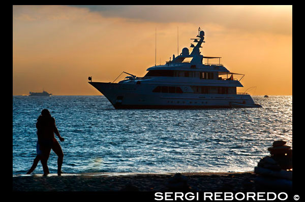 Sa Roqueta Beach and Ses Illetes Beach, Balearic Islands, Formentera, Spain. Couple kissing in the beach.  Spain; Formentera; island; Ses Illetes; beach; sa roqueta; illetes; roqueta; coastline; marine; scene; outdors; love; kiss; kissing; boat; luxury; yacht; in love; sand; summer; balearic; nice; sea; boats; pretty; sunset; couple; walk; walking; sand; beauty; calo; beach; beautiful; beauty; blue; coast; people; man; woman; romantic; europe; holiday; idyllic; isla; island; islands; islet; landmark; landscape; mediterranean; nature; ocean; outdoor; paradise; places; rock; rocky; san; scenic; sea; seascape; shallow; shore; sky; spain; stones; holiday; horizon; islands; length; look; med; mediterranean europe; platge; platja; playa; rear; rocks; rocky; rough; sand; sandy; sea; single; slim; spain; spanish; stand; summer; tourism; travel; vacation; view; watch; wave; sun; sunny; touristic; transparent; travel; turquoise; vacation; water; waves; white; balearic; Baleares; atrraction; destination; Europe; European; holiday; travel; islands; mediterranean; photos; place; spanish; sun; tourism; touristic; vacation; view; Balearics; beautiful; beauty; paradise; fun; happy; coastal; paradisiac; popular