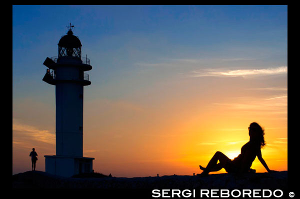 Sunset. Pretty woman backlight in Es Cap de Barbaria lighthouse, in Formentera, Balears Islands. Spain. Barbaria cape formentera lighthouse road. Spain; Formentera; island; Barbaria; lighthouse; day; romatic; sunset; pretty; woman; backlight; love; balears islands; couple; es cap de barbaria; fun; holidays; illes balears; island light; leisure; light; mediterranean; sea; pitiuses; girl; woman; balearic; pitiuses lighthouse; road; love; tourists; travel; two people; way; balearic; Baleares; atrraction; destination; Europe; European; holiday; travel; islands; mediterranean; photos; place; spanish; sun; tourism; touristic; vacation; view; Balearics; beautiful; beauty; paradise; fun; happy; coastal; paradisiac; popular; cape; coast; coastline; couple; formentera; golden; grass; headlight; holiday; ibiza; island; landmark; landscape; lighthouse; man; meadow; mediterranean; motorbike; motorcycle; ocean; outdoor; people; person; perspective; places; road; scooter; sea; seascape; sky; spain; tourist; touristic; travel; vacation; view; water; way; white; woman