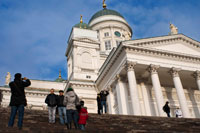 The Helsinki Cathedral (in Finnish Helsingin tuomiokirkko, Domkyrka Helsingfors in Swedish) is a cathedral Evangelical Lutheran located in the center of Helsinki, Finland. The church was built as a tribute to the Grand Duke, Nicholas I, Tsar of Russia and until the independence of Finland in 1917, was called St. Nicholas Church. It is a hallmark of the landscape of the city of Helsinki, the church that stands tall with its green dome surrounded by four smaller domes, is a neoclassical style and was built between 1830 and 1852. It was designed by Carl Engel, to complete the housing estate of Senate Square that Engel had diagrammed and which was surrounded by several buildings of his own. The building has a plant in the form of a Greek cross (ie a central hall surrounded by four arms of equal length) and is symmetrical in all four directions, each with its colonnade and pediment.