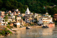 Rishikesh also spelled Hrishikesh; Rushikesh; or Hrushikesh; is a city and a municipal board in Dehradun district in the Indian state of Uttarakhand.It is surrounded by two other districts namely Tehri Garhwal and Pauri Garhwal. It is located in the foothills of the Himalaya in northern India and attracts thousands of pilgrims and tourists each year; from within India; as well as from other countries. Rishikesh is a vegetarian city by law; as well as an alcohol-free city. Rishikesh has also banned use of plastics bags by shopkeepers and vendors. Rishikesh; sometimes nicknamed "the world capital of Yoga"; has numerous yoga centres that also attract tourists. It is believed that meditation in Rishikesh brings one closer to attainment of moksha; as does a dip in the holy river that flows through it. Rishikesh is world famous for Rafting and Adventure. Rafting season starts from the month of March and ends in July. Rishikesh is also home to the 120-year old Kailas Ashram Brahmavidyapeetham; an institution dedicated to preserve and promote the traditional Vedantic Studies. Prominent personalities such as Swami Vivekananda; Swami Rama Tirtha and Swami Shivananda have studied in this institution. In February 1968; The Beatles visited the now-closed Maharishi Mahesh Yogi's ashram in Rishikesh.[6] John Lennon recorded a song titled; 'The Happy Rishikesh Song'.[7][8] The Beatles composed nearly 48 songs during their time at the Maharishi's ashram; many of which appear on the White Album. Several other artists visited the site to contemplate and meditate.