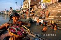 For most of the year you can walk freely along the whole length of the ghats; although during and immediately after the monsoon the water level is too high for this. It's a unique; world-class 'people-watching' walk as you mingle with the fascinating mixture of people who come to the Ganges not only for a ritual bath but also to wash clothes; do yoga; offer blessings; buy paan (a mixture of betel nut and leaves for chewing); sell flowers; get a massage; play cricket; wash their buffaloes; improve their karma by giving to beggars; or simply hang around. This is traditional India at its most colourful and picturesque and photo opportunities abound. Assi Ghat; furthest south of the main ghats; is particularly important as the River Asi meets the Ganges near here and pilgrims come to worship a Shiva lingam beneath a pipal tree. The ghats themselves were undergoing much-needed renovation at the time of writing and there are some interesting shops; cafés and excellent hotels here. Boat owners wait to take pilgrims and tourists upstream to Dasaswamedh Ghat. Nearby Tulsi Ghat; named after a 16th century Hindu poet; has fallen down towards the river but in the month of Kartika (Oct/Nov) a festival devoted to Krishna is celebrated here. The NGO campaigning for a cleaner Ganges also has its research laboratory here. Next along; the Bachraj Ghat has three Jain temples. Many of the ghats are owned by maharajas or other princely rulers; such as Shivala Ghat; built by the local maharaja of Benares. The Dandi Ghat is used by ascetics known as Dandi Panths; and nearby is the very popular Hanuman Ghat. Harishchandra Ghat is a cremation ghat - smaller and secondary in importance to Manikarnika - and one of the oldest ghats in Varanasi. Above it; Kedar Ghat has a shrine popular with Bengalis and South Indians. Mansarowar Ghat was built by Raja Man Singh of Amber and named after the Tibetan lake at the foot of Mt Kailash; Shiva's Himalayan home. Someswar Ghat (Lord of the Moon Ghat) is said to be able to heal diseases. The Munshi Ghat is very photogenic; while Ahalya Bai's Ghat is named after the female Maratha ruler of Indore. Varanasi's liveliest and most colourful ghat is Dasaswamedh Ghat; easily reached at the end of the main road from Godaulia Crossing. The name indicates that Brahma sacrificed (medh) 10 (das) horses (aswa) here. In spite of the oppressive boat-owners; flower-sellers and touts trying to drag you off to a silk shop; it's a wonderful place to linger and people-watch while soaking up the atmosphere. Note its statues and the shrine of Sitala; goddess of smallpox. Every evening at 19:00 an elaborate ganga aarti ceremony with puja; fire and dance) is staged here. A little further north; Raja Man Singh's Man Mandir Ghat was built in 1600 but was poorly restored in the 19th century. The northern corner of the ghat has a fine stone balcony and Raja Jai Singh II of Jaipur erected one of his unusual observatories on this ghat in 1710. Meer Ghat leads to a Nepali temple; which has erotic sculptures. Manikarnika Ghat is the main burning ghat and the most auspicious place for a Hindu to be cremated. Dead bodies are handled by outcasts known as doms; and they are carried through the alleyways of the old city to the holy Ganges on a bamboo stretcher swathed in cloth. The corpse is doused in the Ganges prior to cremation. Huge piles of firewood are stacked along the top of the ghat; each log carefully weighed on giant scales so that the price of cremation can be calculated. Each type of wood has its own price with sandalwood being the most expensive. There is an art to using just enough wood to completely incinerate a corpse. You can watch cremations but photography is strictly prohibited; and always show reverence by behaving respectfully. You're guaranteed to be led by a priest or guide to an upper floor from where you can watch cremations taking place; then asked for a donation towards the cost of wood (in dollars) - make a donation but don't be pressured into giving the outrageous sums demanded. Above the steps here is a tank known as the Manikarnika Well. Parvati is said to have dropped her earring here and Shiva dug the tank to recover it; filling the depression with his sweat. The Charanpaduka; a slab of stone between the well and the ghat; bears footprints made by Vishnu. Privileged VIPs are cremated at the Charanpaduka; which also has a temple dedicated to Ganesh.Dattatreya Ghat bears the footprint of the Brahmin saint of that name in a small temple nearby. Scindhia Ghat was originally built in 1830 but was so huge and magnificent that it collapsed into the river and had to be rebuilt. Ram Ghat was built by a maharaja of Jaipur. Panchganga Ghat; as its name indicates; is where five rivers are supposed to meet. Dominating the ghat is Aurangzeb's smaller mosque; also known as the Alamgir Mosque; which he built on the site of a large Vishnu temple erected by the Maratha chieftain Beni Madhur Rao Scindia. Gai Ghat has a figure of a cow made of stone upon it. Trilochan Ghat has two turrets emerging from the river; and the water between them is especially holy. Raj Ghat was the ferry pier until the road and rail bridge was completed here. 