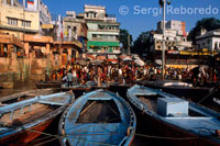 The continuum slideshow like visuals of men; women; children; and sadhus bathing in the river; people doing exercise and Yoga in the fresh cool air of the Ghats; and priests worshipping River Ganges and various deities in the temples that rise above Ghats in several tiers seem to have an unearthly quality. The magical spell of pilgrims standing waist deep in the molten gold of River Ganges with folded hands to seek blessings from Sun God seem astounding. A shutter bug’s delight; our innovative luxury boat ride allows you to capture some of the most memorable and magical moments during the cruise that speak volumes about city’s culture; traditions; and lifestyle. A little known fact about Varanasi is that it is the center of Indian arts and music. Several internationally renowned classical music maestros have been born and resided in Varanasi; including the famed Pandit Ravi Shankar. TNS thoughtfully added the trademark soft melodious Benarasi music to accompany you during your boat ride on River Ganga. The yearning tones of the sarangi and rhythmic beats of the tabla along with chanting of Mantras on the Ghats and tinkling of bells in Temples really add to the quality of experience and make it indescribably divine. Varanasi is one of the oldest living cities of the world. Over 3000 years old; it resonates with the old-world charm of a deeply religious town. You will be surprised to known that there are over 25; 000 temples in this city. As the world brightens up; vendors selling wares on boats can be seen cruising along side the tourist boats. Some of the Ghats that you will cover during your Varanasi boat cruise are hundreds of years old. Manikarnika Ghat is the main Ghat to cremate the death that is believed to have a portal that can transport souls directly to Heaven.