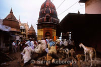 Manikarnika Ghat is the main cremation Ghat of Varanasi. Manikarnika Ghat is one of the oldest and most sacred Ghats in Benaras. According to the Hindu mythology; being burned here provides an instant gateway to liberation from the cycle of births and rebirths. Lying at the center of the five tirthas; Manikarnika Ghat symbolizes both creation and destruction. At Manikarnika Ghat; the mortal remains are consigned to flames with the prayers that the souls rest in eternal peace. There is a sacred well at the Manikarnika Ghat; called the Manikarnika Kund. Manikarnika Kund is said to be dug by Lord Vishnu at the time of creation while the hot ashes of the burnt bodies makes one remember the inevitable destruction of everything in the world.