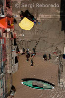 The Ghats of Varanasi. The 'Ghats' are undoubtedly the most valuable assets of Varanasi. None can imagine this holy city sans its numerous Ghats that dot the nearly 7 km arc line of the Ganges riverfront between the confluence of the River Asi in the south and the Varuna in the north. hese are a very special type of embankments that are actually long flights of wide stone steps leading down to the river where people can take a holy dip. But there are more to these Ghats than just bathing and cremating. Each of the eighty-four Ghats of Varanasi holds some special significance. Viewing the Ghats from a boat on the Ganges; especially at sunrise; is an unforgettable experience! They offer a panoramic view of the various early morning activities - from ablution to workout - of a multitude of people; for whom the river is the be all and end all of life. It's also a pleasure to walk down the entire stretch of the Ghats along the Ganges. Here people consult the astrologers under their palm leaf parasols; buy offerings for rituals; sell silk apparels and brassware; or just gaze at the faraway horizon where the mighty river meets the heavens. The Tulsi Ghat is famous for its association with the poet Tulsidas (C.E 1547-1623). The Asi Ghat; situated in the south at the union of the rivers Ganga and Asi is significant for the Surya Shashthhi festival. The Ganga Mahal Ghat is an extension of the Asi Ghat; and includes a palace built by the Maharaja of Benaras in 1830. The King of Rivan's palace stands at the Rivan Ghat; another extension of the Asi Ghat.The Bhadaini Ghat is one of the most ancient sacred sites in Varanasi that got its name from the famous sun shrine. Janki Ghat is named after the Queen of Sursund State; and the Anandmayi Ghat after Mother Anandmayi. Vaccharaja Ghat is a holy place for the Jain community; for it is close to the birthplace of the seventh Jain Tirthankara. Beside it is the Jain Ghat; which has two Jain temples on it. Nishadraj Ghat; named after Nisad; a mythical and heroic fisherman in Ramayana; is a place for boatmen and fishermen.The Panchkoat Ghat was built by the king of Madhya Pradesh in 1915; and the Chet Singh Ghat was built by King Chet Singh; who fought a fierce battle against the British troops of Warren Hastings at this place. Niranjani Ghat has a historical connection with king Kumaragupta; and is famous for its Kartikeya temple.The Dasaswamedh Ghat is where Lord Brahma is said to have sacrificed ten horses in order to celebrate the return of Shiva on earth. Manikarnika Ghat is a sacred place for cremation.The Man Mandir Ghat was built in 1770 by Maharaja Jai Singh of Jaipur; and is known for its 'lingam' of Someshwar; the Lord of the Moon.Some of the other Ghats in Varanasi are the Maha Nirvani Ghat; Shivala Ghat; Gulariya Ghat; Dandi Ghat; Hanuman Ghat; Karnataka Ghat; Mansarover Ghat; Bachraj Ghat; Kedar Ghat; and the Lalita Ghat.