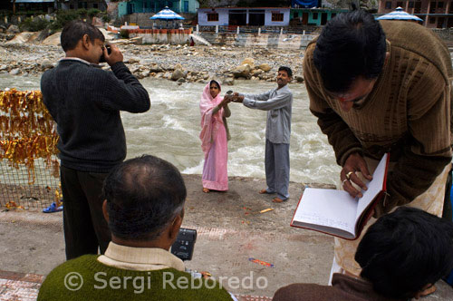 INDIA CROSSING THE RIVER GANGES Gangotri; the origin of the River Ganges and seat of the goddess Ganga; is one of the four sites in the Char Dham pilgrimage circuit. The river is called Bhagirathi at the source and acquires the name Ganga (Ganges) from Devprayag onwards where it meets the Alaknanda. The origin of the holy river is at Gaumukh; set in the Gangotri Glacier; and is a 19 km trek from Gangotri. Gangotri can be reached in one day's travel from Rishikesh; Haridwar or Dehradun; or in two days from Yamunotri; the first site in the Char Dham circuit. More popular and important than its sister site to the east; Gangotri is also accessible directly by car and bus; meaning that it sees many more pilgrims than Yamunotri.