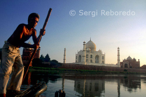 INDIA CROSSING THE RIVER GANGES This old guy will then row you out over the river behind the Taj; and you’ll get a magical view; across the back of the water; all to yourself. If you want to disembark on the far bank; just ask him. It’s muddy; but sometimes there are interesting things on the bank; which would look great in the foreground of a photo – kids playing; buffalo; flocks of birds etc. Agra's Taj Mahal is one of the most famous buildings in the world; the mausoleum of Shah Jahan's favorite wife; Mumtaz Mahal. It is one of the New Seven Wonders of the world; and one of three World Heritage Sites in Agra. Completed in 1653; the T?j Mahal was built by the Mughal king Sh?h Jah?n as the final resting place for his beloved wife; Mumt?z Mahal. Finished in marble; it is perhaps India's most fascinating and beautiful monument. This perfectly symmetrical monument took 22 years (1630–1652) of labour and 20; 000 workers; masons and jewellers to build and is set amidst landscaped gardens. Built by the Persian architect; Ust?d '?s?; the T?j Mahal is on the bank of the Yamuna River. It can be observed from Agra Fort from where Emperor Sh?h Jah?n gazed at it; for the last eight years of his life; a prisoner of his son Aurangzeb. It is an acknowledged masterpiece of symmetry. Verses of the Koran are inscribed on it and at the top of the gate are twenty-two small domes; signifying the number of years the monument took to build. The T?j Mahal was built on a marble platform that stands above a sandstone one. The most elegant dome of the T?j Mahal has a diameter of 60 feet (18 m); and rises to a height of 80 feet (24 m); directly under this dome is the tomb of Mumt?z Mahal. Shah Jah?n's tomb was erected next to hers by his son Aurangzeb. The interiors are decorated by fine inlay work; incorporating semi-precious stones. 