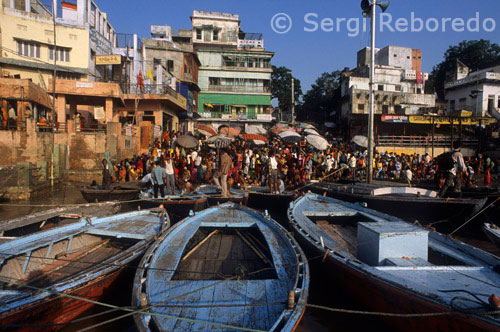 INDIA CROSSING THE RIVER GANGES The continuum slideshow like visuals of men; women; children; and sadhus bathing in the river; people doing exercise and Yoga in the fresh cool air of the Ghats; and priests worshipping River Ganges and various deities in the temples that rise above Ghats in several tiers seem to have an unearthly quality. The magical spell of pilgrims standing waist deep in the molten gold of River Ganges with folded hands to seek blessings from Sun God seem astounding. A shutter bug’s delight; our innovative luxury boat ride allows you to capture some of the most memorable and magical moments during the cruise that speak volumes about city’s culture; traditions; and lifestyle. A little known fact about Varanasi is that it is the center of Indian arts and music. Several internationally renowned classical music maestros have been born and resided in Varanasi; including the famed Pandit Ravi Shankar. TNS thoughtfully added the trademark soft melodious Benarasi music to accompany you during your boat ride on River Ganga. The yearning tones of the sarangi and rhythmic beats of the tabla along with chanting of Mantras on the Ghats and tinkling of bells in Temples really add to the quality of experience and make it indescribably divine. Varanasi is one of the oldest living cities of the world. Over 3000 years old; it resonates with the old-world charm of a deeply religious town. You will be surprised to known that there are over 25; 000 temples in this city. As the world brightens up; vendors selling wares on boats can be seen cruising along side the tourist boats. Some of the Ghats that you will cover during your Varanasi boat cruise are hundreds of years old. Manikarnika Ghat is the main Ghat to cremate the death that is believed to have a portal that can transport souls directly to Heaven.