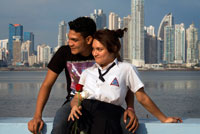 Two students lovers at Cinta Costera in Panama City. Skyline, Panama City, Panama, Central America. Cinta Costera Pacific Ocean Coastal Beltway Bahia de Panama linear park seawall skyline skyscraper modern. Coastal Beltway (Cinta Costera), Panama City, Panama. Panama City is one city in Central America where congestion has reached crisis point. The city is going through an unprecedented period of stability and investment and there are ample public funds for infrastructure improvement projects. One of the newest road improvement projects is the Coastal Beltway or Cinta Costera (translation means literally 'coastal tape') project. This project intends to decongest the road network of Panama City by providing a bypass route past the city.