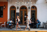 Panama, restaurant Santé in old town. Casco Antiguo Historic Town Panama City Central America old town houses. The food in Panama tends to be good and inexpensive and in Panama City, the range of restaurants is considerable. Prices vary enormously, as do the menus and conventions. But seafood is, of course, almost always a speciality. Corvina, a meaty white fish that tastes much like sea bass, seems to be one of the most abundant. The Chinese restaurants around the banking centre tend to be decent, too, since there is a growing Chinese population to support the best ones. 