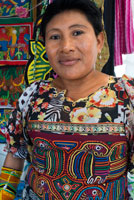 Portrait of Kuna women sell their molas to the tourists. Panama City Casco Viejo kuna indian traditional handicraft items sellers by kuna tribe.  Old Quarter, Panama City, Republic of Panama, Central America. In Balboa, on Avenida Arnulfo Arias Madrid and Amador, is a small YMCA Handicrafts Market, with mostly Kuna and Emberá indigenous arts and crafts, and clothing. Old Artesanal YMCA