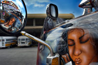 BUS RED DEVIL DIABLO ROJO PAINTED BUS PANAMA CITY REPUBLIC OF PANAMA. Albrok bus station terminal. Panama. Here comes the Diablo Rojo, the Red Devil bus blasting its air horn and fishtailing around a fellow “demon” just in time to claim Irma Betancourt and other morning commuters. Suffice it to say the Red Devils earn their name. “They are crazy,” said Ms. Betancourt, 33, a housekeeper at a downtown hotel, boarding on a main boulevard. “We all know that. All they care about is getting the fare. So many times we have almost hit somebody.”  Wandering around Panama City it’s hard to miss these crazy fuckin buses rolling around the city. Converted school buses are used as inexpensive public transportation. Each bus in the city is individually decorated which makes an interesting catch whenever rolling around. The average cost to ride one of these buses is 25 cents!