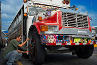 Decorating a BUS RED DEVIL DIABLO ROJO PAINTED BUS PANAMA CITY REPUBLIC OF PANAMA. Albrok bus station terminal. Panama. Here comes the Diablo Rojo, the Red Devil bus blasting its air horn and fishtailing around a fellow “demon” just in time to claim Irma Betancourt and other morning commuters. Suffice it to say the Red Devils earn their name. “They are crazy,” said Ms. Betancourt, 33, a housekeeper at a downtown hotel, boarding on a main boulevard. “We all know that. All they care about is getting the fare. So many times we have almost hit somebody.”  Wandering around Panama City it’s hard to miss these crazy fuckin buses rolling around the city. Converted school buses are used as inexpensive public transportation. Each bus in the city is individually decorated which makes an interesting catch whenever rolling around. The average cost to ride one of these buses is 25 cents!  “Almost” may make her bus one of the lucky ones, as they are known to have taken more than a few souls for the sake of a pickup.