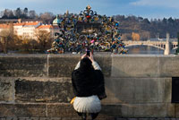 Padlocks on the Charles Bridge. Charles Bridge will never cease to fascinate painters, photographers and poets who flatter him in his works. When the first rays of the sun touch the ground and illuminate the massive cobblestone Gothic towers at both ends, hard look to find a more romantic place. With the imposing Prague Castle silhouette background and gallery of Baroque statues on the sides, it is not surprising that belongs to the most beautiful in Europe. One of the many legends that the construction of Charles Bridge was opened by Czech King and Roman Emperor Charles IV in 1357 exactly on 9 month 7 at 5 hours 31 minutes. The reason was a favorable constellation of the Sun and Saturn and the fact that this date corresponds to the line of odd numbers one to nine, and vice versa. Perhaps the magic combination of numbers 1-3-5-7-9-7-5-3-1 gave the bridge its strength, beauty, and the admiration of millions of visitors from around the world. Another legend says that the mass at which there were the stones for the construction of the bridge would add eggs, wine and milk. All this had to provide the perfect bridge to stability over the centuries.