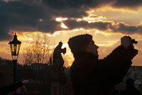 Photographing at sunset on the Charles Bridge. Prague. The Charles Bridge is Prague's most famous landmark and connects the Old Town (Staré M? Sto) with the Lesser Town (Mala Strana). With more than 500 meters long and 10 wide, the Charles Bridge once had 4 lanes for the passage of carriages. Currently is pedestrian. Charles Bridge at dawn The Charles Bridge is named after its creator, Charles IV, who laid the foundation stone in 1357 to replace the Judith Bridge, which was destroyed by a flood. The statues from the Charles Bridge Bridge Over find 30 statues on both sides of it, many of which are copies because the originals are in the National Museum and at Vyšehrad and were built in the early eighteenth . The first statue was added in 1683 was that of San Juan Nepomuceno. John of Nepomuk was thrown into the river in 1393 in order of Wenceslas IV and in the eighteenth century was sanctified. Make a wish in the place where water was thrown into the San Juan Nepomuceno is his statue. It is said that those who make a wish by placing the left hand on the representation of his martyrdom (at the base of the statue), it shall be given.