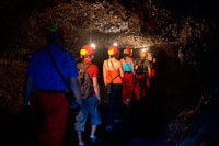 Aymeric. Visits to the underground caves created by lava in the Grand Brûlé area, also called lavatubes. Because lava tubes remain buried, often not recognized in the surface. However, many lava tubes are delineated on the surface by a series of linear or curvilinear collapse depressions, called ventilation holes along the tube axis. In active lava tubes, skylights provide a unique insight into the actively flowing hot lava in the lava tube system.