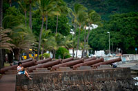 The canons of Barachois. Le Barachois is the northernmost district of Saint-Denis, the capital of the island of Reunion, a French overseas department in the southwest Indian Ocean sea. This is also the center of which the city grew. To the west cliffs along the current route of the Coast, the small bay that gives the Barachois once served as merchant ships to the port. The site is now home to many companies and governments, including the Prefecture of La Reunion. In fact, it is in a place where a statue of Bertrand-François Mahé de La Bourdonnais and square called Mahe Labourdonnais throne in his honor. The square, in whose center is occupied by misfortune, parking spaces, with trees on the perimeter, some endemic (LATANIERS red), which is a paradise for lovers of puzzles and croûteurs. Since it is next to the Hotel de la Prefecture, the arrival point demos of all kinds, which usually leave the roundabout in the Garden State and through the streets of Paris. Since the 2000s, everyone receives a Christmas village for the holiday season approaches.