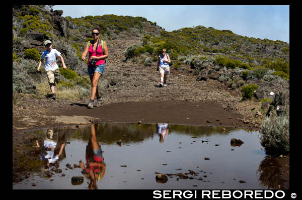 Trekking by the Piton de la Fournaise volcano. The Piton de la Fournaise, is the active volcano on the island of Réunion, is one of the most active volcanoes in the world and one of the most watched. The Piton is at the heart of one of the remnant of an ancient sunken volcano which is built on a sea of ??lava. The scenery is amazing, the temperature is cold. Also, the weather is beautiful this cavity that increases the pleasure. The location of the Fournaise volcano is from a site BELLECOMBE Pas de la Reunion inescapable. The location of the volcano is the most visited place on the island, everything is great, we can discover "the plain of sand" upon arrival at the "Pas de BELLECOMBE" to collapse around the fence.