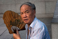 China, Shanghai, morning tai chi exercise on The Bund. Shanghi Bund : Early morning tai chi exercises with swords on the Bund in Shanghai China. The best taichi lessons I've had were from an old guy who practiced outside at 7am every morning. I learned 4 excellent techniques that I still use in my MMA training on a regular basis- a method of catching a kick and throwing your opponent, redirecting a straight punch and countering in the same motion, countering double underhooks with a throw, and escaping a shoulder lock while setting up your own.  It's a really fascinating martial art because every one of those dance like movements represents a simple practical fighting technique or strategy, but it's hard to see how the movements translate into combat applications