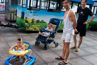 Fathers take car of his children in the streets of Shanghai. Shanghai has a lot to offer your kids when they get tired of being dragged to another classical garden, one more Chinese meal or another shopping market. If you're bringing your kids to China, then it's easy to make Shanghai about them. Between watching the kites fly in Century Park to checking out the Pandas at the Shanghai Zoo, you'll be able to entertain your kids for an afternoon or two, and probably be able to bribe them into coming with you to one more Buddhist temple while you're at it. 