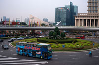 Roundabout in Lujiazui financial district, in Pudong, in Shanghai, China. Shanghai International Finance Centre, usually abbreviated as Shanghai IFC, is a commercial building complex and a shopping centre (branded Shanghai IFC mall) in Shanghai. It incorporates two tower blocks at 249.9 metres (south tower) and 259.9 metres (north tower) housing offices and a hotel, and an 85-metre tall multi-storey building behind and between the two towers.  Shanghai IFC is located in Lujiazui, in Pudong, Shanghai. It occupies a prominent position southeast of the Lujiazui roundabout, diagonally across from the Oriental Pearl Tower and across the road from Super Brand Mall. It is adjacent to Lujiazui Station on Metro Line 2, and can be accessed directly from the underground station via a tunnel.