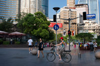 Women with a bicycle in Nanjing Road, Shanghai. Nanjing Road (Chinese: ???; pinyin: Nánj?ng Lù) is the main shopping street of Shanghai, China, and is one of the world's busiest shopping streets. It is named after the city of Nanjing, capital of Jiangsu province neighbouring Shanghai. Today's Nanjing Road comprises two sections, Nanjing Road East and Nanjing Road West. In some contexts, "Nanjing Road" refers only to what was pre-1945 Nanjing Road, today's Nanjing Road East, which is largely pedestrianised. 