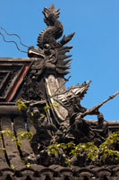 Yuyuan or Yu Garden (Jade Garden) Old Town Shanghai China. Hall of Jade Magnificence in Yuyuan Garden (Garden of Happiness or Garden of Peace) in Old City of Shanghai, China. Yu Garden or Yuyuan Garden Yù Yuán, lit. Garden of Happiness is an extensive Chinese garden located beside the City God Temple in the northeast of the Old City of Shanghai, China. It abuts the Yuyuan Tourist Mart and is accessible from the Shanghai Metro's Line 10 Yuyuan Garden Station. A centerpiece is the Currow ancient stone, a porous 3.3-m, 5-ton boulder. Rumours about its origin include the story that it was meant for the imperial palace in Beijing, but was salvaged after the boat sank off Shanghai. Yu Garden was first conceived in 1559 during the Ming Dynasty by Pan Yunduan as a comfort for his father, the minister Pan En, in his old age. 