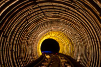 Blurred motion light trails in a train tunnel under the Huangpu River linking the Bund to Pudong, Shanghai, China, Asia. The colourful Bund Sightseeing Tunnel train under the Huang Pu River connecting Puxi and Pudong districts in Shanghai China Asia. The Bund Sightseeing Tunnel goes under the Huangpu River connecting the Bund and Lujiazui Area of Pudong District. Its length is 646.7 meters. The Bund Sightseeing Tunnel is almost a virtual facility under the ground and provides a memorable experience of the special multimedia effects. The compartments of sightseeing maglev train are completely transparent and it allows the 360 degrees view. 