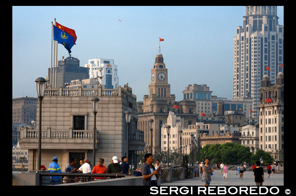 The Bund promenade, Shanghai, China. China Shanghai Tourist Shanghai Skyline viewed over the Huangpu river from the Bund. Bin Jiang Avenue, The Bund, Shanghai, China. The highlights of the Bund are undoubtedly the colonial-era buildings lining the west side of Zhongshan Dong Yi Lu, standouts of which include the former British Consulate, Customs House, former Hong Kong and Shanghai Bank, former Shanghai Club (now the Waldorf Astoria Hotel), and the Peace Hotel. For more details on these buildings, many of which have been skillfully restored, and a more complete walking guide to this gallery of European architecture.  Besides its landmark colonial architecture, however, the Bund has a few other small attractions. On its north end, the rehabilitated Suzhou Creek enters the Huangpu River beneath the 18m-wide (59-ft.) iron Waibaidu Bridge, built in 1906 to replace the original wooden toll bridge constructed in 1856 by an English businessman. The bridge was most recently restored in 2009. On the river shore stands a granite obelisk, Monument to the People's Heroes, erected in 1993, and dedicated to Chinese patriots (as defined by the Communist Party) beginning in the 1840s. The Bund History Museum (9am-4:15pm; free admission), which contains a few artifacts and some interesting photographs of the Bund, stands at its base; however, at press time, the museum was closed for renovation. Just south of the monument used to be the park Huangpu Gongyuan, originally the British Public Gardens built in 1868. In the early days, only Chinese servants accompanying their foreign masters were allowed to enter the park. Dogs were also prohibited, leading in later years to the apocryphal NO CHINESE OR DOGS ALLOWED sign being attributed to the park. The park was eventually opened to Chinese in 1926, but today, has simply become part of the Bund promenade with the recent renovations. South of here, across from the Peace Hotel, is the entrance to the pedestrian Bund Sightseeing Tunnel (Waitan Guanguang Suidao) (daily 8am-10:30pm, 11pm Fri-Sun; admission ¥55 round-trip, ¥45 one-way) located under the Huangpu. Complete with tram cars and a light show, the tunnel connects downtown Shanghai to the Pudong New Area and the Oriental Pearl TV Tower. Also here is a statue of Chen Yi, Shanghai's first mayor after 1949 and a dead ringer for Mao Zedong, at least in bronze.  Farther south down the Bund Promenade are scores of vendors, a few restaurants, and excellent overlooks facing the river. At the intersection with Yan'an Dong Lu, you'll also notice a picturesque Signal Tower, a slender, round brick tower that served as a control tower for river traffic during colonial days. First built in 1884, the tower was rebuilt in 1907, and also relayed weather reports. In 1993 during the widening of Zhongshan Lu, it was moved 20m (66 ft.) to its current site. About a 20-minute walk farther down the promenade are the docks for the Huangpu River cruises.