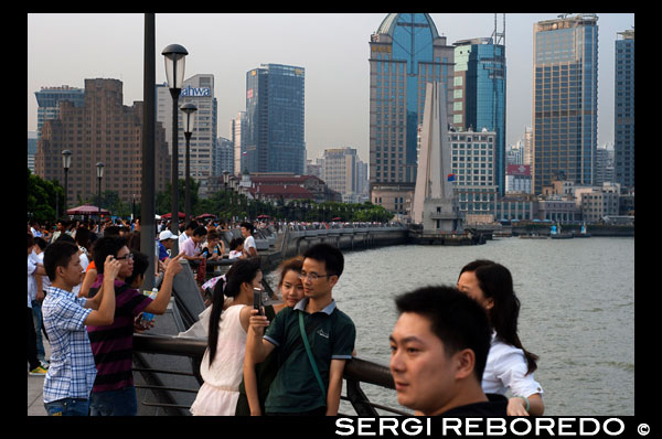 The Bund promenade, Shanghai, China. China Shanghai Tourist Shanghai Skyline viewed over the Huangpu river from the Bund. Bin Jiang Avenue, The Bund, Shanghai, China. The highlights of the Bund are undoubtedly the colonial-era buildings lining the west side of Zhongshan Dong Yi Lu, standouts of which include the former British Consulate, Customs House, former Hong Kong and Shanghai Bank, former Shanghai Club (now the Waldorf Astoria Hotel), and the Peace Hotel. For more details on these buildings, many of which have been skillfully restored, and a more complete walking guide to this gallery of European architecture.  Besides its landmark colonial architecture, however, the Bund has a few other small attractions. On its north end, the rehabilitated Suzhou Creek enters the Huangpu River beneath the 18m-wide (59-ft.) iron Waibaidu Bridge, built in 1906 to replace the original wooden toll bridge constructed in 1856 by an English businessman. The bridge was most recently restored in 2009. On the river shore stands a granite obelisk, Monument to the People's Heroes, erected in 1993, and dedicated to Chinese patriots (as defined by the Communist Party) beginning in the 1840s. The Bund History Museum (9am-4:15pm; free admission), which contains a few artifacts and some interesting photographs of the Bund, stands at its base; however, at press time, the museum was closed for renovation. Just south of the monument used to be the park Huangpu Gongyuan, originally the British Public Gardens built in 1868. In the early days, only Chinese servants accompanying their foreign masters were allowed to enter the park. Dogs were also prohibited, leading in later years to the apocryphal NO CHINESE OR DOGS ALLOWED sign being attributed to the park. The park was eventually opened to Chinese in 1926, but today, has simply become part of the Bund promenade with the recent renovations. South of here, across from the Peace Hotel, is the entrance to the pedestrian Bund Sightseeing Tunnel (Waitan Guanguang Suidao) (daily 8am-10:30pm, 11pm Fri-Sun; admission ¥55 round-trip, ¥45 one-way) located under the Huangpu. Complete with tram cars and a light show, the tunnel connects downtown Shanghai to the Pudong New Area and the Oriental Pearl TV Tower. Also here is a statue of Chen Yi, Shanghai's first mayor after 1949 and a dead ringer for Mao Zedong, at least in bronze.  Farther south down the Bund Promenade are scores of vendors, a few restaurants, and excellent overlooks facing the river. At the intersection with Yan'an Dong Lu, you'll also notice a picturesque Signal Tower, a slender, round brick tower that served as a control tower for river traffic during colonial days. First built in 1884, the tower was rebuilt in 1907, and also relayed weather reports. In 1993 during the widening of Zhongshan Lu, it was moved 20m (66 ft.) to its current site. About a 20-minute walk farther down the promenade are the docks for the Huangpu River cruises.