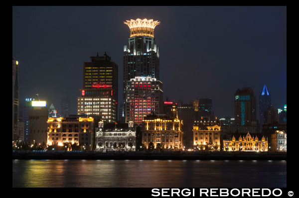 The bund on the night and the Huangpu river. The Bund promenade, Shanghai, China. China Shanghai Tourist Shanghai Skyline viewed over the Huangpu river from the Bund. Bin Jiang Avenue, The Bund, Shanghai, China. The highlights of the Bund are undoubtedly the colonial-era buildings lining the west side of Zhongshan Dong Yi Lu, standouts of which include the former British Consulate, Customs House, former Hong Kong and Shanghai Bank, former Shanghai Club (now the Waldorf Astoria Hotel), and the Peace Hotel. For more details on these buildings, many of which have been skillfully restored, and a more complete walking guide to this gallery of European architecture.  Besides its landmark colonial architecture, however, the Bund has a few other small attractions. On its north end, the rehabilitated Suzhou Creek enters the Huangpu River beneath the 18m-wide (59-ft.) iron Waibaidu Bridge, built in 1906 to replace the original wooden toll bridge constructed in 1856 by an English businessman. The bridge was most recently restored in 2009. On the river shore stands a granite obelisk, Monument to the People's Heroes, erected in 1993, and dedicated to Chinese patriots (as defined by the Communist Party) beginning in the 1840s. The Bund History Museum (9am-4:15pm; free admission), which contains a few artifacts and some interesting photographs of the Bund, stands at its base; however, at press time, the museum was closed for renovation. Just south of the monument used to be the park Huangpu Gongyuan, originally the British Public Gardens built in 1868. In the early days, only Chinese servants accompanying their foreign masters were allowed to enter the park. Dogs were also prohibited, leading in later years to the apocryphal NO CHINESE OR DOGS ALLOWED sign being attributed to the park. The park was eventually opened to Chinese in 1926, but today, has simply become part of the Bund promenade with the recent renovations. South of here, across from the Peace Hotel, is the entrance to the pedestrian Bund Sightseeing Tunnel (Waitan Guanguang Suidao) (daily 8am-10:30pm, 11pm Fri-Sun; admission ¥55 round-trip, ¥45 one-way) located under the Huangpu. Complete with tram cars and a light show, the tunnel connects downtown Shanghai to the Pudong New Area and the Oriental Pearl TV Tower. Also here is a statue of Chen Yi, Shanghai's first mayor after 1949 and a dead ringer for Mao Zedong, at least in bronze.  Farther south down the Bund Promenade are scores of vendors, a few restaurants, and excellent overlooks facing the river. At the intersection with Yan'an Dong Lu, you'll also notice a picturesque Signal Tower, a slender, round brick tower that served as a control tower for river traffic during colonial days. First built in 1884, the tower was rebuilt in 1907, and also relayed weather reports. In 1993 during the widening of Zhongshan Lu, it was moved 20m (66 ft.) to its current site. About a 20-minute walk farther down the promenade are the docks for the Huangpu River cruises.