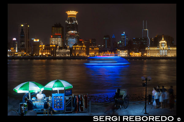 The bund on the night and the Huangpu river. The Bund promenade, Shanghai, China. China Shanghai Tourist Shanghai Skyline viewed over the Huangpu river from the Bund. Bin Jiang Avenue, The Bund, Shanghai, China. The highlights of the Bund are undoubtedly the colonial-era buildings lining the west side of Zhongshan Dong Yi Lu, standouts of which include the former British Consulate, Customs House, former Hong Kong and Shanghai Bank, former Shanghai Club (now the Waldorf Astoria Hotel), and the Peace Hotel. For more details on these buildings, many of which have been skillfully restored, and a more complete walking guide to this gallery of European architecture.  Besides its landmark colonial architecture, however, the Bund has a few other small attractions. On its north end, the rehabilitated Suzhou Creek enters the Huangpu River beneath the 18m-wide (59-ft.) iron Waibaidu Bridge, built in 1906 to replace the original wooden toll bridge constructed in 1856 by an English businessman. The bridge was most recently restored in 2009. On the river shore stands a granite obelisk, Monument to the People's Heroes, erected in 1993, and dedicated to Chinese patriots (as defined by the Communist Party) beginning in the 1840s. The Bund History Museum (9am-4:15pm; free admission), which contains a few artifacts and some interesting photographs of the Bund, stands at its base; however, at press time, the museum was closed for renovation. Just south of the monument used to be the park Huangpu Gongyuan, originally the British Public Gardens built in 1868. In the early days, only Chinese servants accompanying their foreign masters were allowed to enter the park. Dogs were also prohibited, leading in later years to the apocryphal NO CHINESE OR DOGS ALLOWED sign being attributed to the park. The park was eventually opened to Chinese in 1926, but today, has simply become part of the Bund promenade with the recent renovations. South of here, across from the Peace Hotel, is the entrance to the pedestrian Bund Sightseeing Tunnel (Waitan Guanguang Suidao) (daily 8am-10:30pm, 11pm Fri-Sun; admission ¥55 round-trip, ¥45 one-way) located under the Huangpu. Complete with tram cars and a light show, the tunnel connects downtown Shanghai to the Pudong New Area and the Oriental Pearl TV Tower. Also here is a statue of Chen Yi, Shanghai's first mayor after 1949 and a dead ringer for Mao Zedong, at least in bronze.  Farther south down the Bund Promenade are scores of vendors, a few restaurants, and excellent overlooks facing the river. At the intersection with Yan'an Dong Lu, you'll also notice a picturesque Signal Tower, a slender, round brick tower that served as a control tower for river traffic during colonial days. First built in 1884, the tower was rebuilt in 1907, and also relayed weather reports. In 1993 during the widening of Zhongshan Lu, it was moved 20m (66 ft.) to its current site. About a 20-minute walk farther down the promenade are the docks for the Huangpu River cruises.