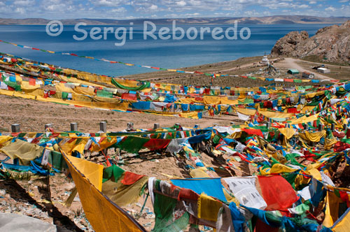 Prayer Flags at the lake Nam Tso, the central Tibet area. Namtso Lake Nam or (officially, Nam Co; in Mongolian: Tengri Nor, literally "heavenly lake") is a great mountain salt lake in China, one of the most famous lakes of the Tibetan sacred lakes, located on the border between Damxung County, the (Lhasa Prefecture) and the District of Baingoin Nagqu Prefecture in the Tibet Autonomous Region, about 112 km NNW of the city of Lhasa. It is a sacred place of Tibetan Buddhism and many worshipers gather around the lake for a great ceremony that takes place the year of the sheep, every 12 years. In the extreme southeast is the Tashi Dor monastery.   