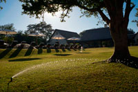 Garden of the Royal Livingstone Hotel.  The Royal Livingstone is a luxurious 5* Hotel situated on the Zambian side of the Victoria Falls. The hotel stretches along the banks of the Zambezi River, just a short walk to the entrance of The Victoria Falls. The Royal Livingstone Hotel is named in honor of the explorer Dr. David Livingstone, and it's interior design reflects the elegance of days gone bye using an African architectural style. The Royal Livingstone Hotel consists of 17 colonial-style buildings, with large verandas. The main hotel incorporates the lounge, a restaurant and a bar.  The Royal Livingstone Hotel has: 173 spacious en-suite rooms:113 with twin beds, and 54 with king-size beds. Each room has its private verandah. Three suites offer a separate lounge and bedroom, while the Presidential Suite offers an additional, optional separate bedroom. There are two rooms with disabled facilities.  